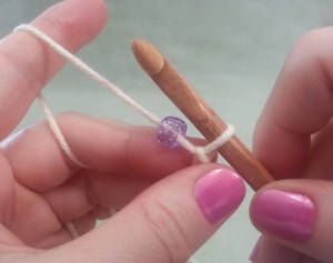 Slide bead up close to hook.