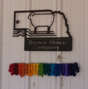 Brown Sheep Sign on Building